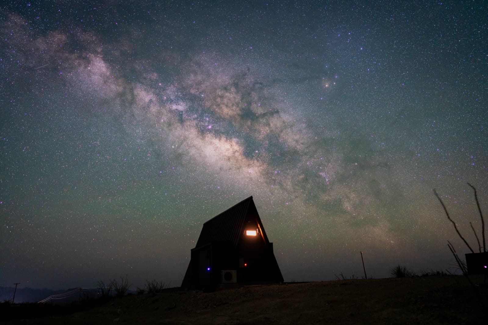 A-frame cabin under the Milky Way at Stardust Big Bend